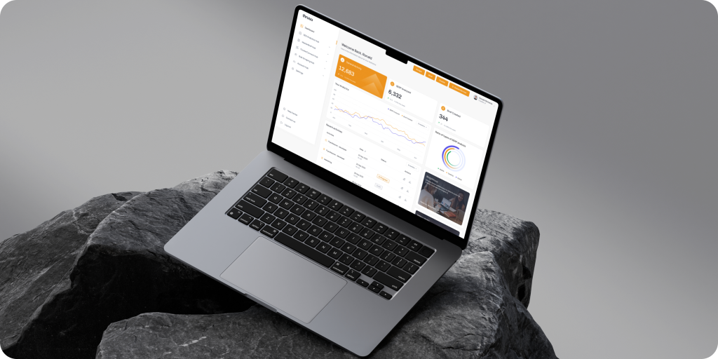 Free MacBook Pro mockup on stone pedestal (Mockuuups Studio)